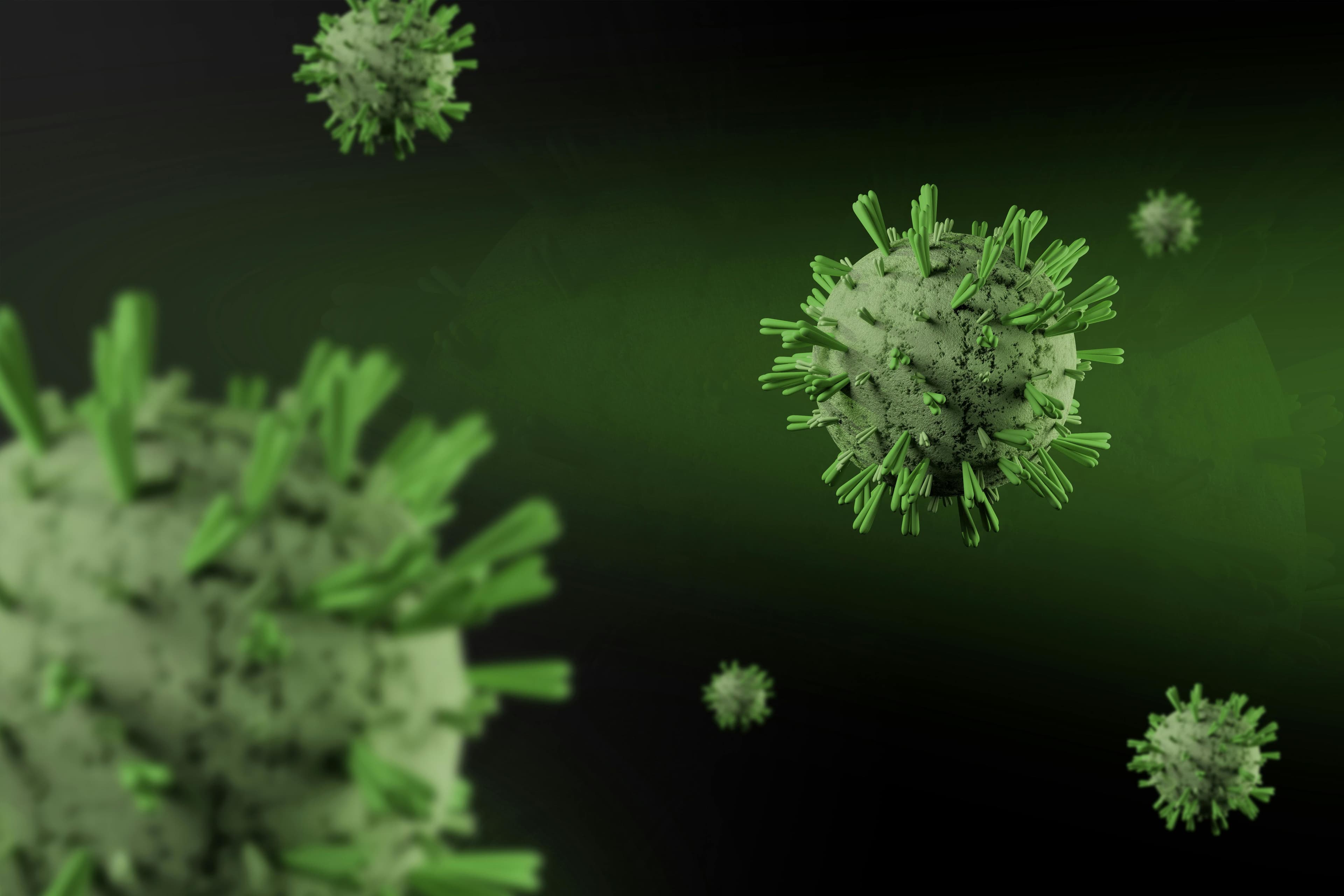 A digital illustration of green, spiky virus particles floating against a dark green background.